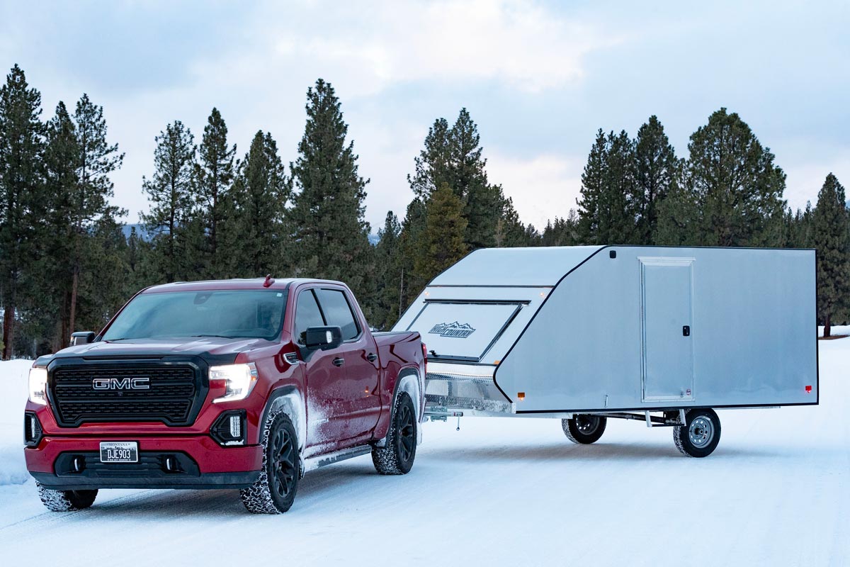 High Country Enclosed Crossover Snow White Trailer Attached To White Truck